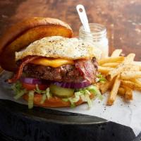 Farmhouse Burger · Smoked bacon, over-easy fried egg, American cheese, lettuce and tomato