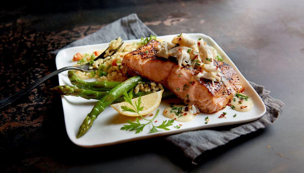 Salmon Oscar · Fresh salmon topped with lump crab meat and lemon butter. Served with choice of 2 sides.