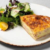 Quiche Lorraine · buttery crust filled with ham, Gruyère and leeks, served with seasonal green salad