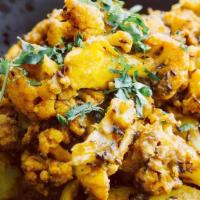 Vegan Aloo Gobi · Spicy. Fresh cauliflower and soft potatoes cooked in a dry curry with special spices.