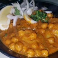 Vegan Chana Masala · Spicy. Chef's special dish. Garbanzo beans mixed with herbs and spices simmered in a onion/t...