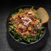 Chef  Salad   · Includes: Ham, Turkey, Cheese on Salad Greens with Tomatoes, Seasoned Croutons and Specialty...