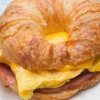 Croissant Sandwich · Served with 2 Cage Free Eggs with Choice of Smoked Bacon, Black Forest Ham or Sausage Patty ...