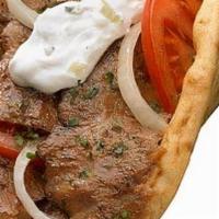 Mediterranean Gyro · Our Hand-made Gyro is Prepared with Thinly Sliced Marinated Authentic  Lamb and Beef Meat.

...
