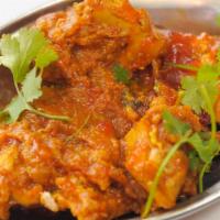 Chicken Curry · Marinated Tandoori Chicken Pieces In Onion Based Sauce.