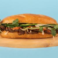 Pork Banh Mi · Grilled sliced pork with cucumber, jalapeno, cilantro, pickled carrots and sriracha mayo on ...