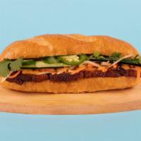 Pork Belly Banh Mi · Pork belly with cucumber, jalapeno, cilantro, pickled carrots and sriracha mayo on a french ...