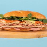 Classic Banh Mi · Paté and ham with cucumber, jalapeno, cilantro, pickled carrots and sriracha mayo on a frenc...