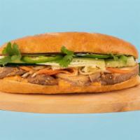 Chicken Banh Mi · Grilled sliced chicken with cucumber, jalapeno, cilantro, pickled carrots and sriracha mayo ...