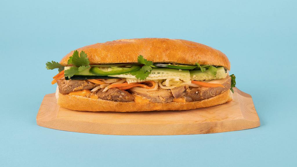 Chicken Banh Mi · Grilled sliced chicken with cucumber, jalapeno, cilantro, pickled carrots and sriracha mayo on a french roll.