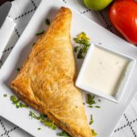 Sambosa · Stuffed dough with your choice of one of the following
cheese, spinach, or meat.