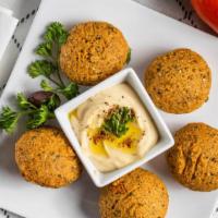Falafel · A mixture of garbanzo and fava beans with vegetable ground and
fried.
