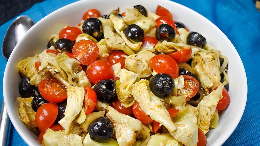 Artichoke Salad · Marinated artichoke hearts mixed with chopped olives and garlic
Scented citrus dressing.