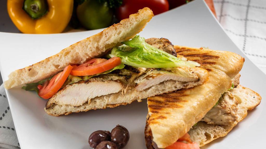 The Kavala Panini · It comes with lettuce, tomato, sauce, and french fries.
