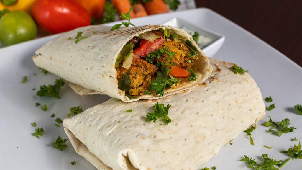 Falafel Wrap · It comes with lettuce, tomato, and sauce.