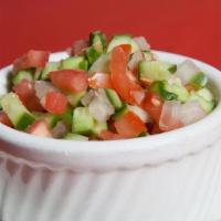 Shirazi Salad · Chopped cucumber, onion, tomatoes, lemon juice and spices