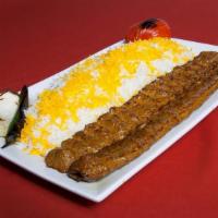 Beef Kabob · Two skewers of charbroiled ground beef seasoned with onions and spices served with grilled t...