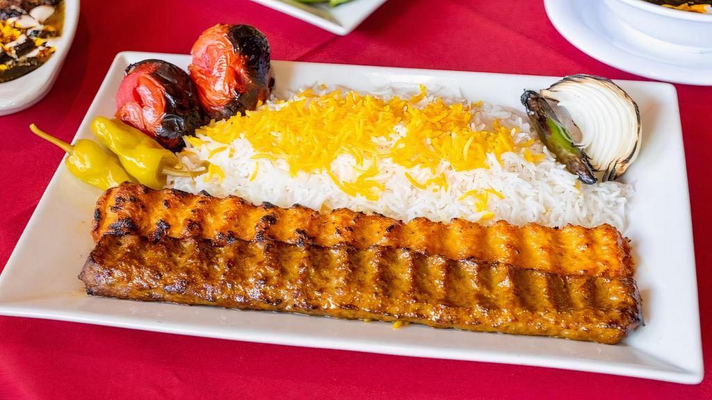 Kobideh Combination · Combination of one skewer of ground beef and skewer of ground chicken Kabob served with grilled tomato, Serrano pepper, onion and imported basmati rice topped with saffron.