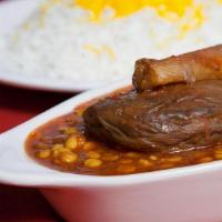 Gheymeh Bademjan · Chunks of beef cooked in tomato paste, yellow split peas, Sauteed eggplant served with impor...