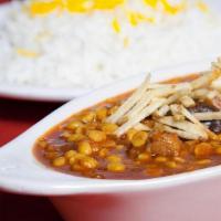 Gheymeh · Chunks of shoulder beef cooked in tomato paste and yellow split peas served with imported ba...