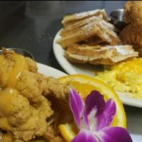 Cajun Fried Lobster Tail & Waffles · Tender cajun seasoned, deep fried Lobster Tail served with Waffles, 2 eggs, choice of Butter...