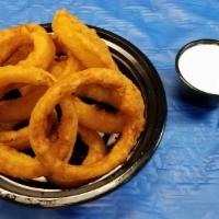 Whiskey Battered Onion Rings · Whiskey flavored onion rings double battered to perfection. Served with a side of Homestyle ...