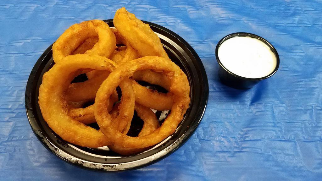Whiskey Battered Onion Rings · Whiskey flavored onion rings double battered to perfection. Served with a side of Homestyle Ranch dressing