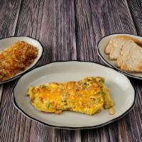 Classic Denver Omelette · Slow roasted diced ham, green bell peppers, onions and mild cheddar cheese.
