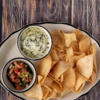 Spinach & Artichoke Dip · Spinach and artichoke dip served with tortilla chips and salsa.