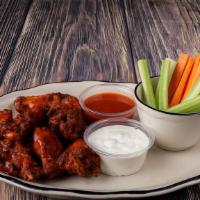 Buffalo Wings · Tender chicken wings are deep fried to perfection and then drowned in our own spicy hot sauce.