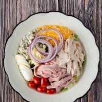 Chef’S Salad · Chopped greens with turkey, ham, a blend of cheeses, hard boiled egg and chopped tomatoes on...