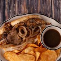 French Dip Sandwich · A generous portion of thinly sliced roast beef brisket piled high on a toasted French roll w...