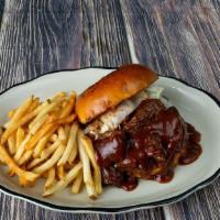 Old Western Bbq Beef Sandwich · A generous portion of show roasted beef brisket on a burger bun topped with melted cheddar c...