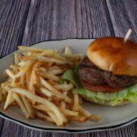 The House Burger · Our juicy hamburger served with fresh lettuce, tomato, pickle slice and 1000 island dressing.