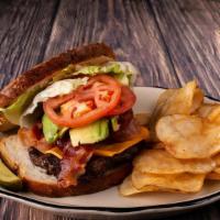 The Frisco Sourdough Burger · A California classic, angus beef patty on grilled sourdough bread with tomato, melted Americ...