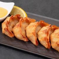 Handmade Fried Gyoza (6Pc) · A Bestseller! Handmade juicy pork dumplings.