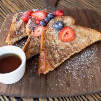 French Toast · Thick Brioche Toast dipped into Homemade Batter, topped with Fresh Fruit & dusted with Powde...
