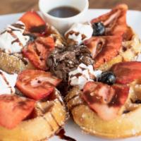 Nutella Waffle · Four mini Waffles topped with Nutella, Strawberries, Whipped Cream & drizzled with our House...