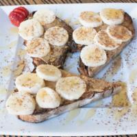 Ocean Beach · Almond butter, Banana and Cinnamon drizzled with Honey on Walnut Raisin Toast.
