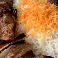 Shish Kebab · a skewer of grilled Persian spiced steak, with bell peppers and onions, grilled over an open...