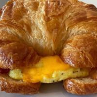 Mark · Sous vide eggs, cheddar, bacon house aioli served on a croissant.