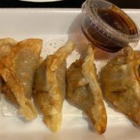 Beef Gyoza (6 Pieces) · Deep fried dumpling.