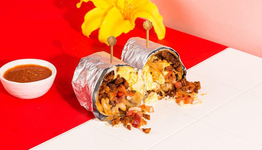 Gabby'S Breakfast Burrito · Bacon, chorizo, two scrambled eggs, melted cheese, caramelized onion, potatoes, tomato, wrapped in a fresh tortilla with a side of pico de gallo.