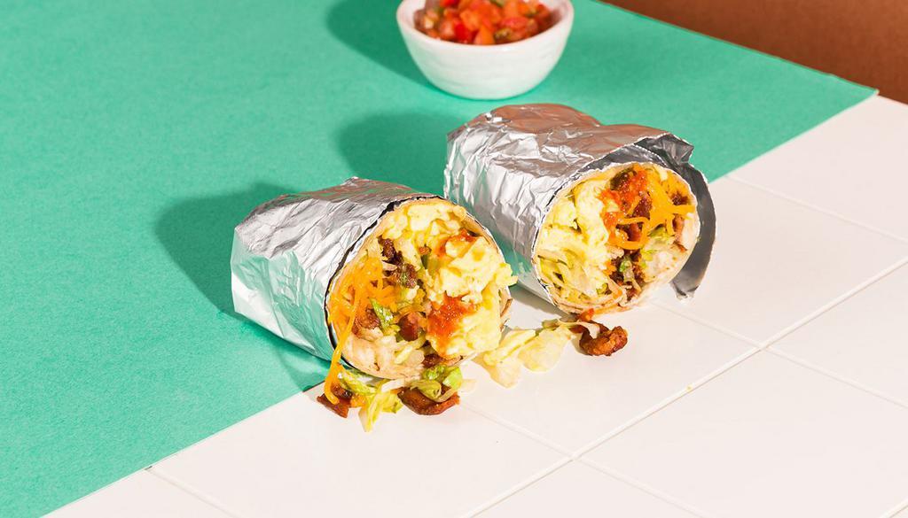 Blt Breakfast Burrito · Bacon, two scrambled eggs, melted cheese, shredded lettuce, wrapped in a fresh tortilla with a side of pico de gallo.