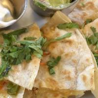 Veggie Quesadilla · Cheese, bell peppers, onions, mushrooms, cabbage served with guacamole and sour cream