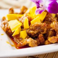 Thai Mango Chicken Stir Fry · Deep fried chicken in light batter with fresh cut mango in sweet mango chili sauce.