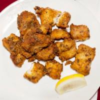 Fish Pakora · Fish napped in the batter of gram flour, deep fried to crisp perfection.