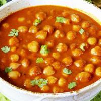 Chana Masala · Garbanzo beans cooked with special spices served with gravy.