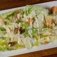 Caesar Salad · Heart of romaine leaf, croutons and Parmesan cheese in a caesar dressing.