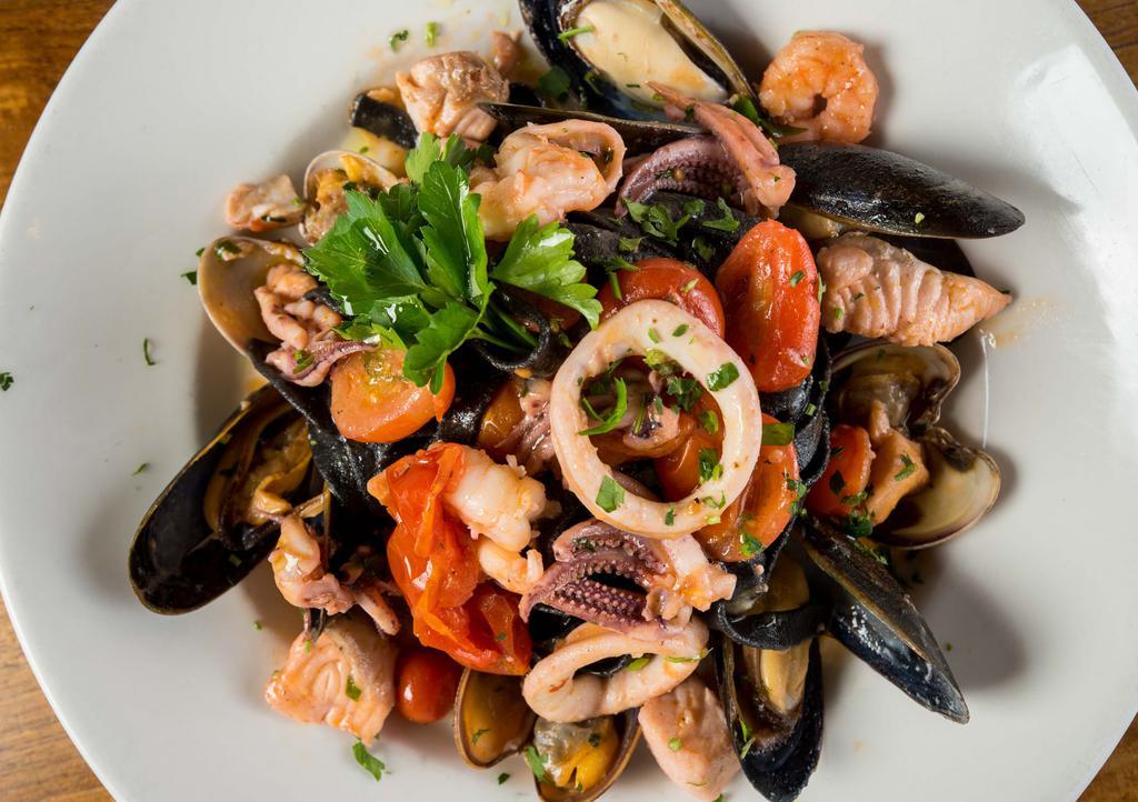 Taglierini Neri Ai Frutti Di Mare · Homemade squid ink pasta with sautéed clams, mussels, calamari, and shrimp, served in olive oil, garlic, chopped tomato, basil, oregano, white wine marinara sauce.